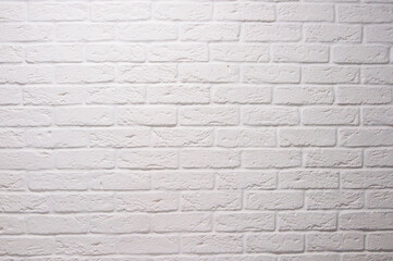 Texture of a white painted brick wall as a background or wallpaper