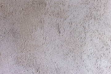 Background cement wall. Gray unpainted wall. Rough wall.