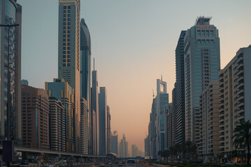 Beautiful Dubai downtown road in city center skyline with many skyscrapers buildings, United Arab Emirates.