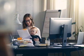 Portrait of a professional and beautiful young business woman and mom who is happy to be able to...