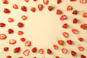 Flat lay with tasty strawberry on beige background, top view. Summer berry