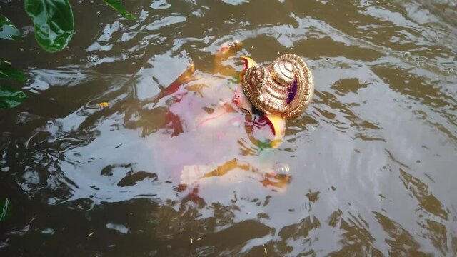 immersion of indian god ganesh idol.