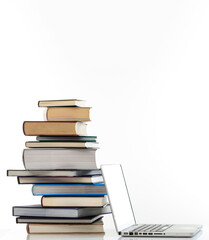 Elearning, books stack and a laptop isolated on white background