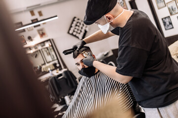 Haircut in quarantine. Haircut in masks from the virus. Hair and health care.