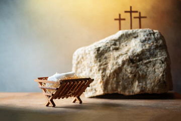 Wooden manger, three crosses background. Jesus - reason for season. Christian Christmas, Easter...