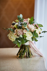 beautiful bridal bouquet lying on the table