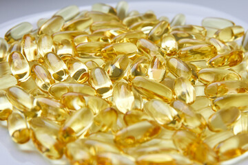Fish oil in capsules on a white background. Omega 3.