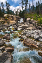 Fototapeta na wymiar Waterfalls of Cold stream in Great Cold Valley in High Tatras, Slovakia.