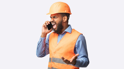 Angry Builder Yelling In Cellphone Standing In Studio, Panorama