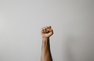 Fist raised with white background