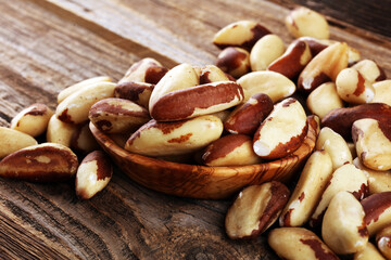 Brazil nuts on vintage background. unshelled Bertholletia healthy vegetarian food