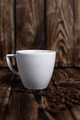 steaming cup of espresso coffee on a wooden table