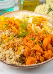 Vegan quinoa bowl with baked spiced pumpkin, fennel, bell pepper and turmeric. Healthy gluten free lunch or dinner