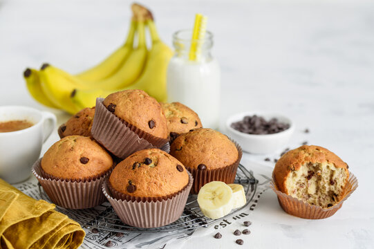 Chocolate banana cupcake muffins on a metal stand on a white background. Selective focus