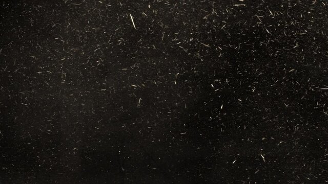 4K Dust and hay explosion cloud swirling and descending in slow-motion  