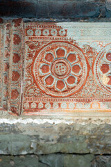 Decorative relief on the wall of the ancient temple of Angkor Wat in Cambodia. High quality photo