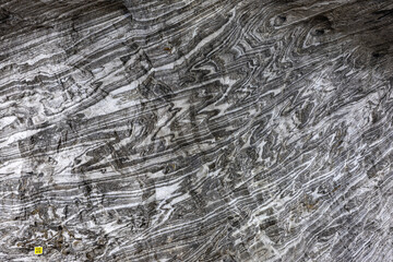 Abstract gray texture of natural, raw salt in an underground salt mine