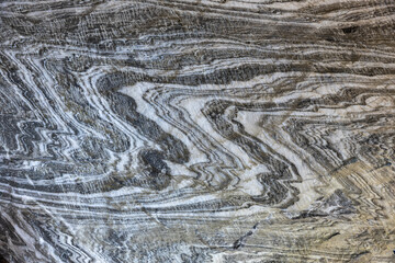 Abstract gray texture of natural, raw salt in an underground salt mine