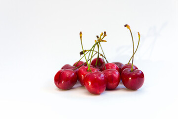Juicy ripe cherries on a white background. Selective focus