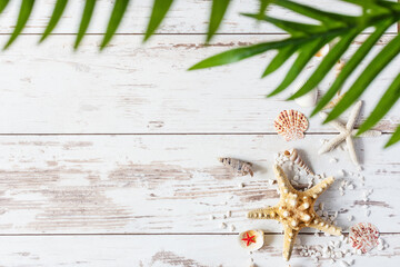 Sea starfish and shells on wooden background top view.