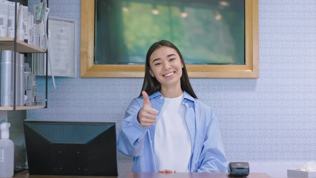 Portrait of a charismatic woman seller in a shop she looking straight to the camera and smiling large. Shot on ARRI Alexa Mini