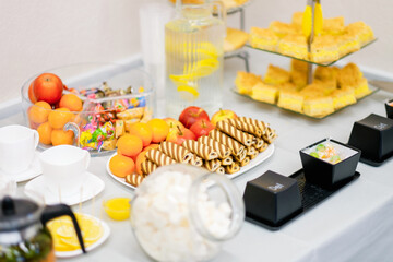 Decorated catering banquet menu with different food snacks and appetizers with sandwich. Banquet service. Plate in the form of computer keyboard keys.