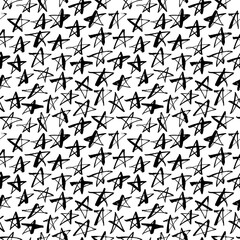 Seamless pattern with hand drawn stars. Doodle vector background. Black and white ink illustration. 