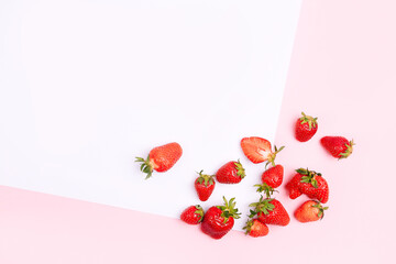 Seamless pattern with strawberry on pink and white background.
