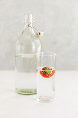 healthy eating, drinks, diet, detox with fruit water in glass bottle with lime and mint