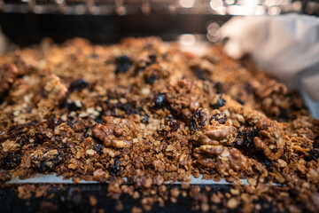 granola to cook in an electric oven. concept of simple ingredients for healthy breakfast