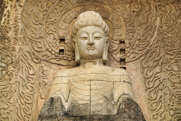 Fototapeta na wymiar a complex of cave temples with a buddha carved into the rock