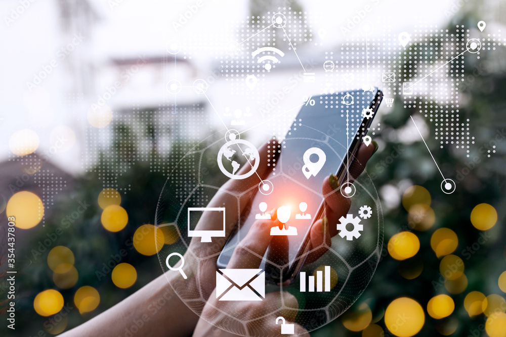 Aufkleber technology in a fast moving world concept. hands using smartphone with network icon.