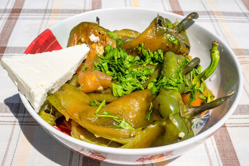 roasted peppers on a plate whit cheese