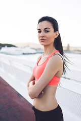 Young brunette woman in stylish sports wear