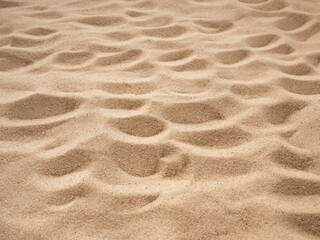 Fototapeta na wymiar Loose sand is beige. Background for your design