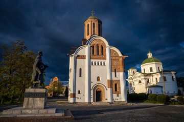 Beautiful dark blue thundercloud over the city. Monument to the founder of the city Yaroslav the Wise. Churches on the background of thunderclouds.