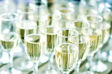 Glasses with white wine on table in restaurant on the table for event.