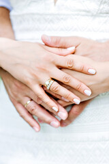 Hands of newlywed couple together. Wedding day. Man and woman hands holding together, wedding photo