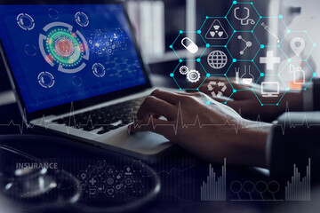 Medical technology and futuristic concept. Doctor using laptop and hologram modern virtual screen interface.