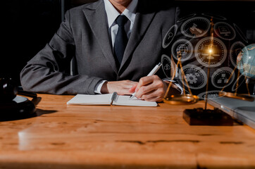 Wooden gavel with scales of justice and lawyer businessman working law in office workplace for consultant lawyer concept.