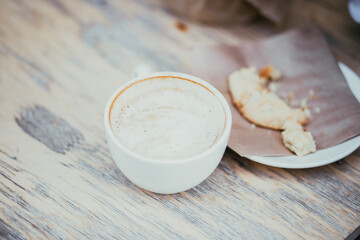 Latte in a cafe, delicious coffee with cookies