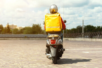 Courier Man Riding Scooter Delivering Food From Restaurants Outdoors, Back-View