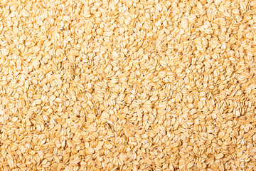 Background of raw oat flakes cereals from above