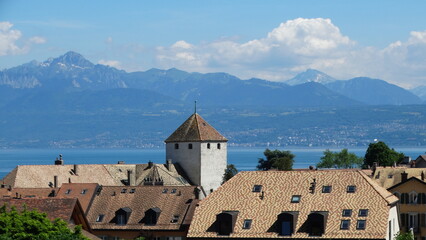 Fototapeta na wymiar Old castle in the mountains lake of Switzerland city of St-Prex