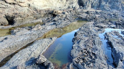 where the land meets the sea and forms paradise