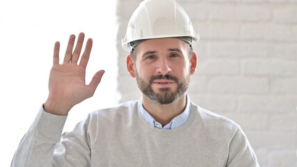 Professional Young Engineer Waving Hand for Video Chat