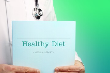 Healthy Diet. Doctor (male) with stethoscope holds medical report in his hands. Cutout. Green turquoise background. Text is on the documents. Healthcare/Medicine