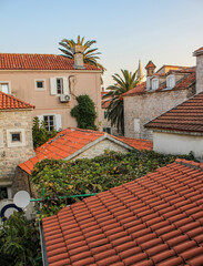 Houses with orange brick roof in old town, Buddha, Montenegro. Closeup shot of an orange bricked...