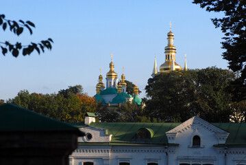 Church with green-gold doom in Ukraine where river streams