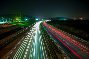 Fototapeta na wymiar Traffic on highway at night.